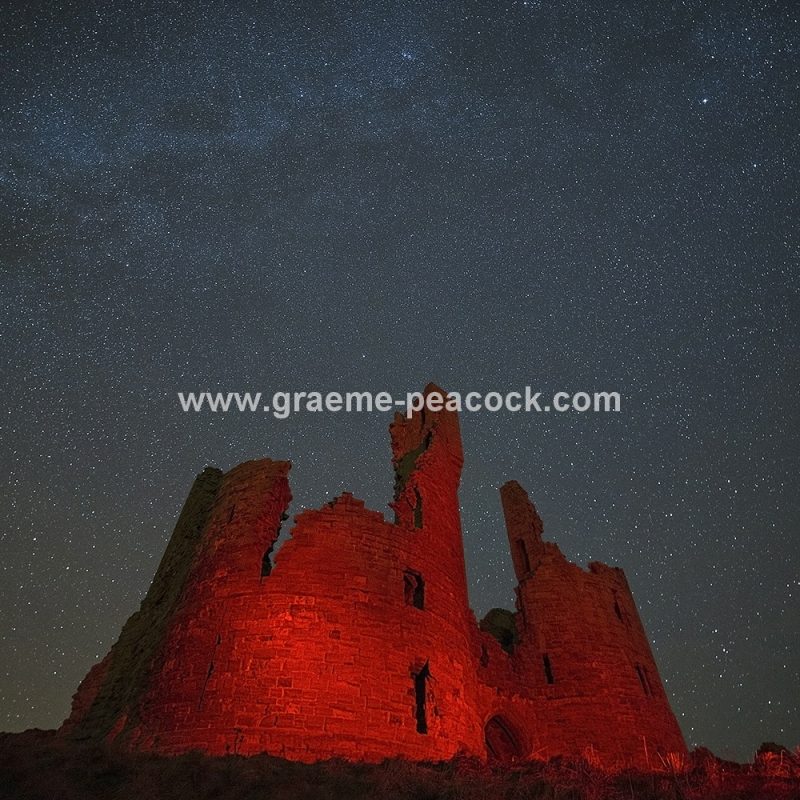 Star gazing under 'Dark Skies' at Dunstanburgh Castle near Craster, Northumberland