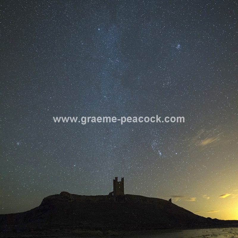 Star gazing under 'Dark Skies' at Dunstanburgh Castle near Craster, Northumberland