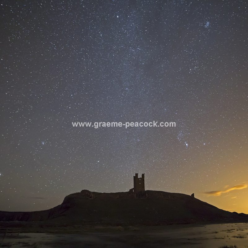 Star gazing under 'Dark Skies' at Dunstanburgh Castle near Craster, Northumberland