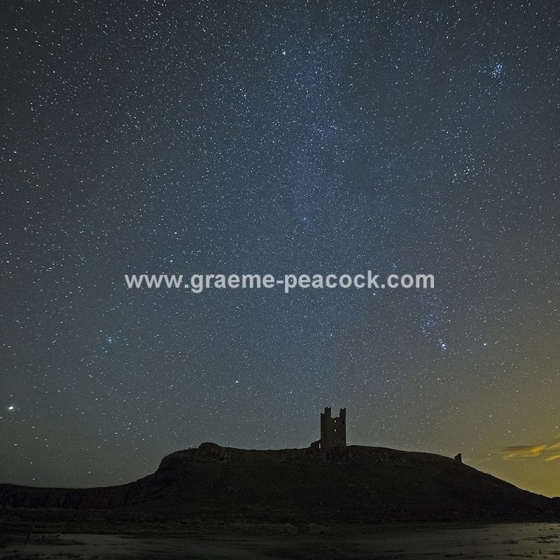 Star gazing under 'Dark Skies' at Dunstanburgh Castle near Craster, Northumberland