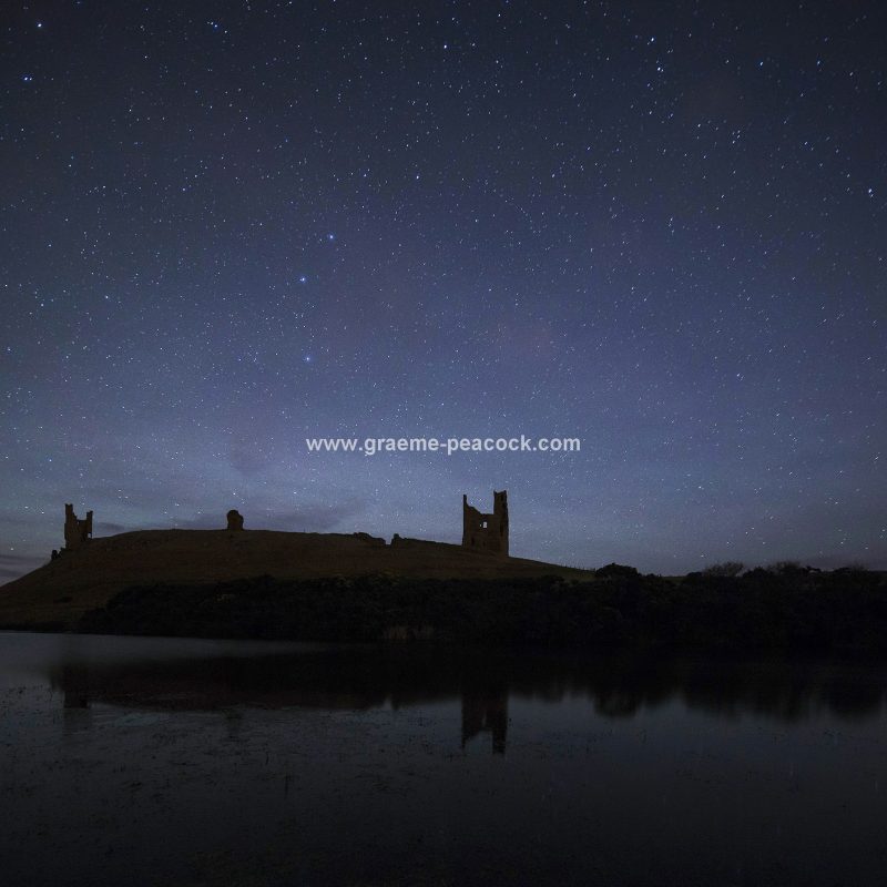 Star gazing under 'Dark Skies' at Dunstanburgh Castle near Craster, Northumberland