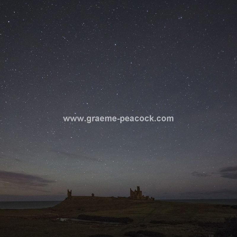 Star gazing under 'Dark Skies' at Dunstanburgh Castle near Craster, Northumberland