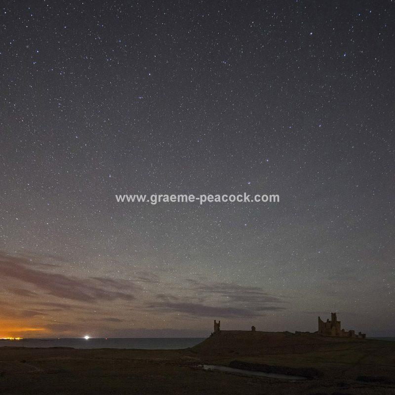Star gazing under 'Dark Skies' at Dunstanburgh Castle near Craster, Northumberland