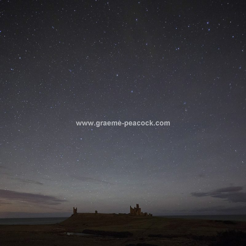 Star gazing under 'Dark Skies' at Dunstanburgh Castle near Craster, Northumberland
