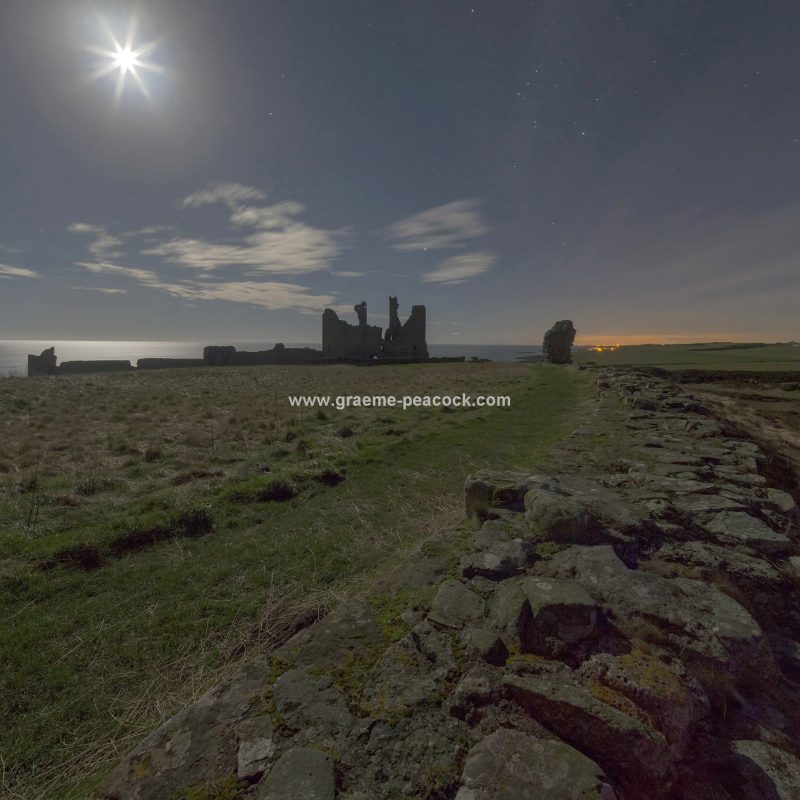 Star gazing under 'Dark Skies' at Dunstanburgh Castle near Craster, Northumberland