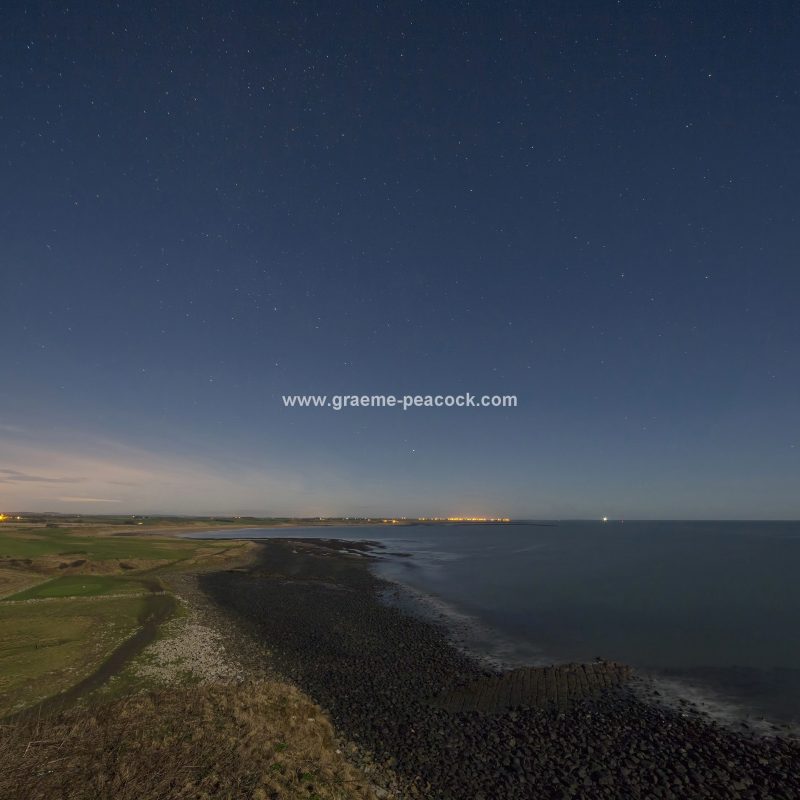 Star gazing under 'Dark Skies' at Dunstanburgh Castle near Craster, Northumberland