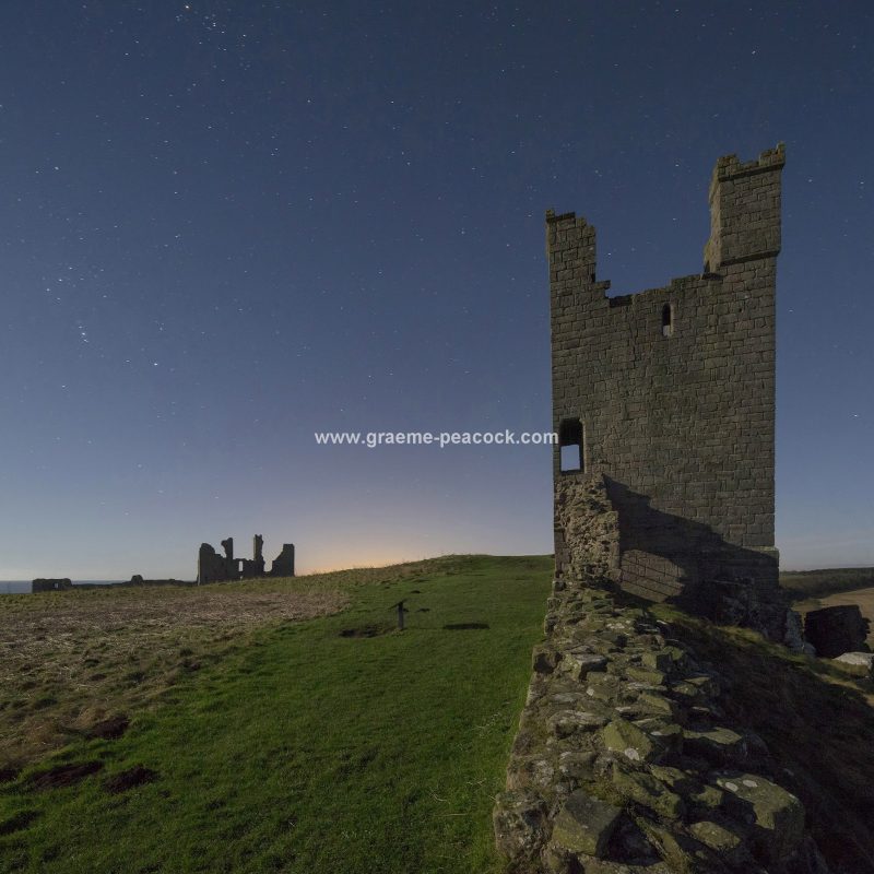 Star gazing under 'Dark Skies' at Dunstanburgh Castle near Craster, Northumberland