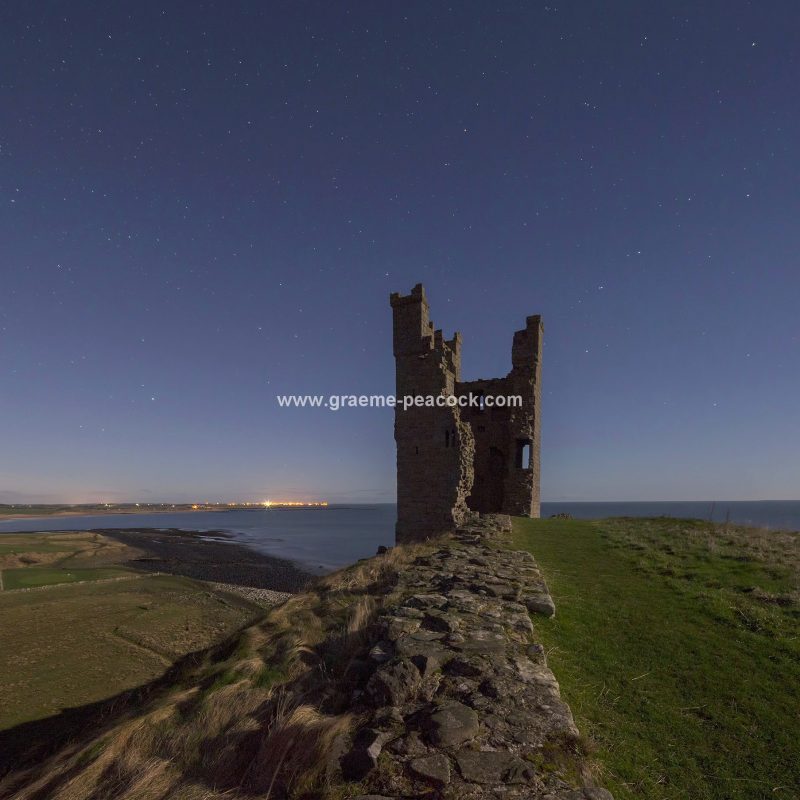 Star gazing under 'Dark Skies' at Dunstanburgh Castle near Craster, Northumberland