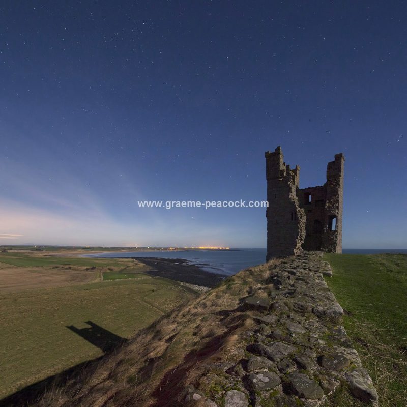 Star gazing under 'Dark Skies' at Dunstanburgh Castle near Craster, Northumberland