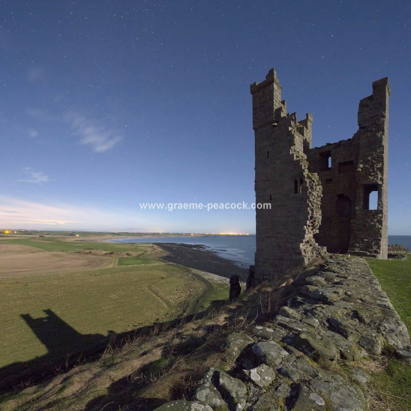 Star gazing under 'Dark Skies' at Dunstanburgh Castle near Craster, Northumberland