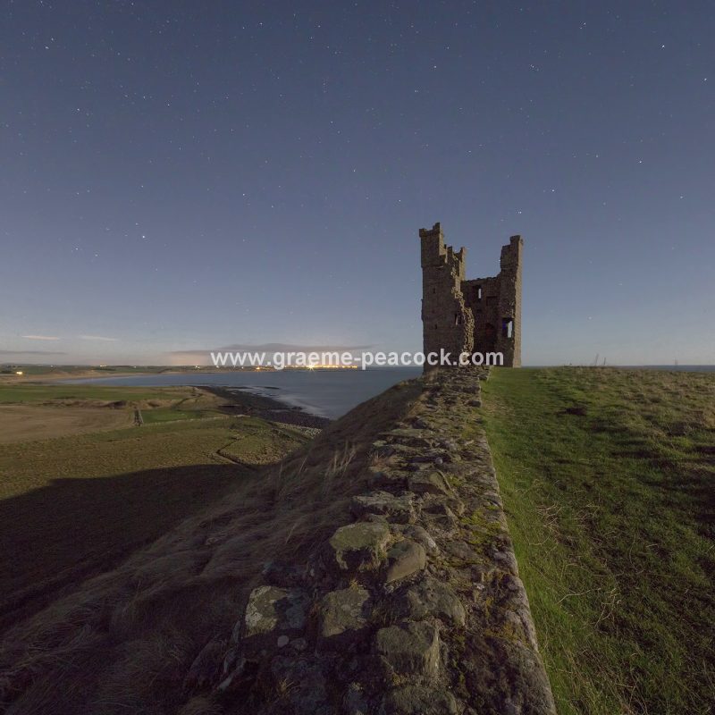 Star gazing under 'Dark Skies' at Dunstanburgh Castle near Craster, Northumberland