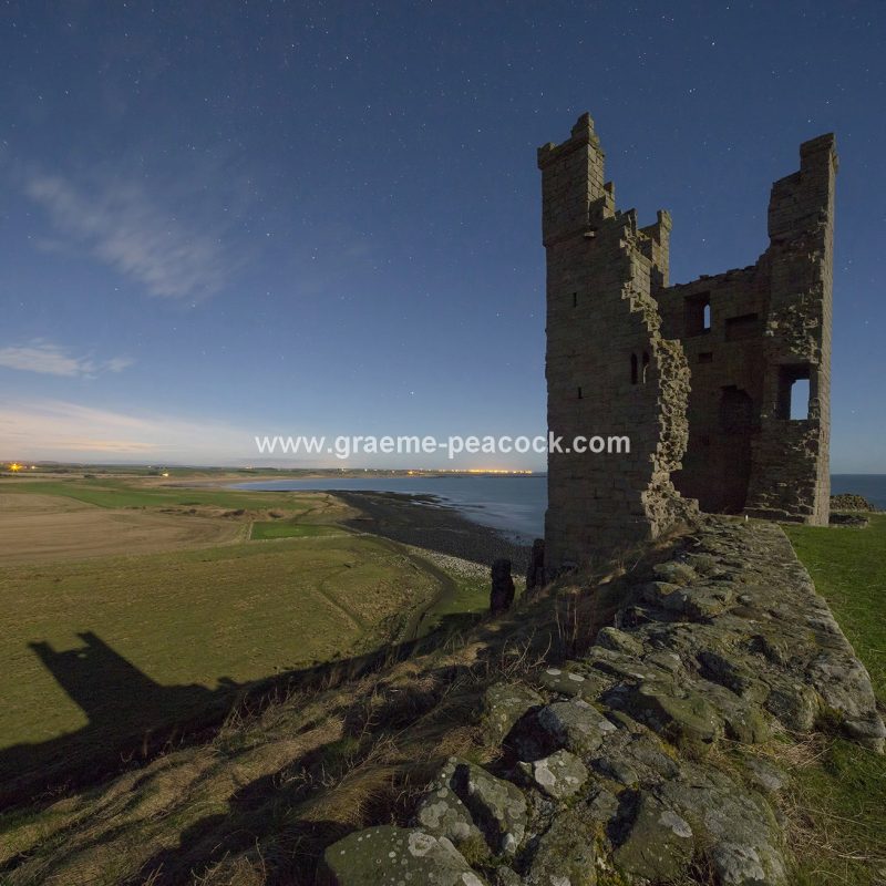 Star gazing under 'Dark Skies' at Dunstanburgh Castle near Craster, Northumberland