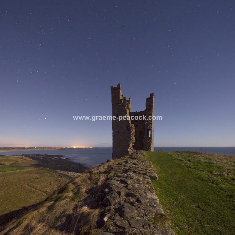 Star gazing under 'Dark Skies' at Dunstanburgh Castle near Craster, Northumberland