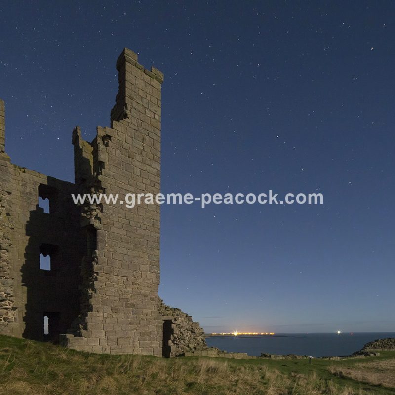 Star gazing under 'Dark Skies' at Dunstanburgh Castle near Craster, Northumberland