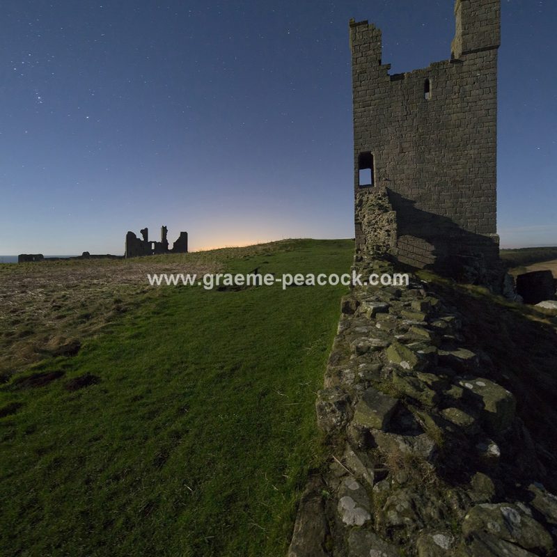 Star gazing under 'Dark Skies' at Dunstanburgh Castle near Craster, Northumberland