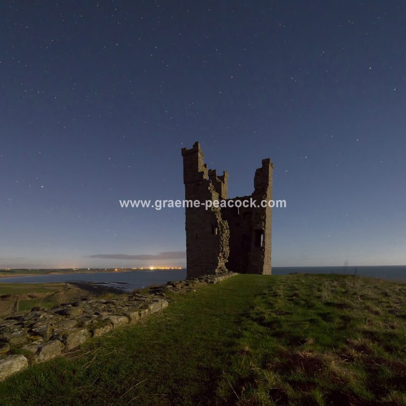 Star gazing under 'Dark Skies' at Dunstanburgh Castle near Craster, Northumberland