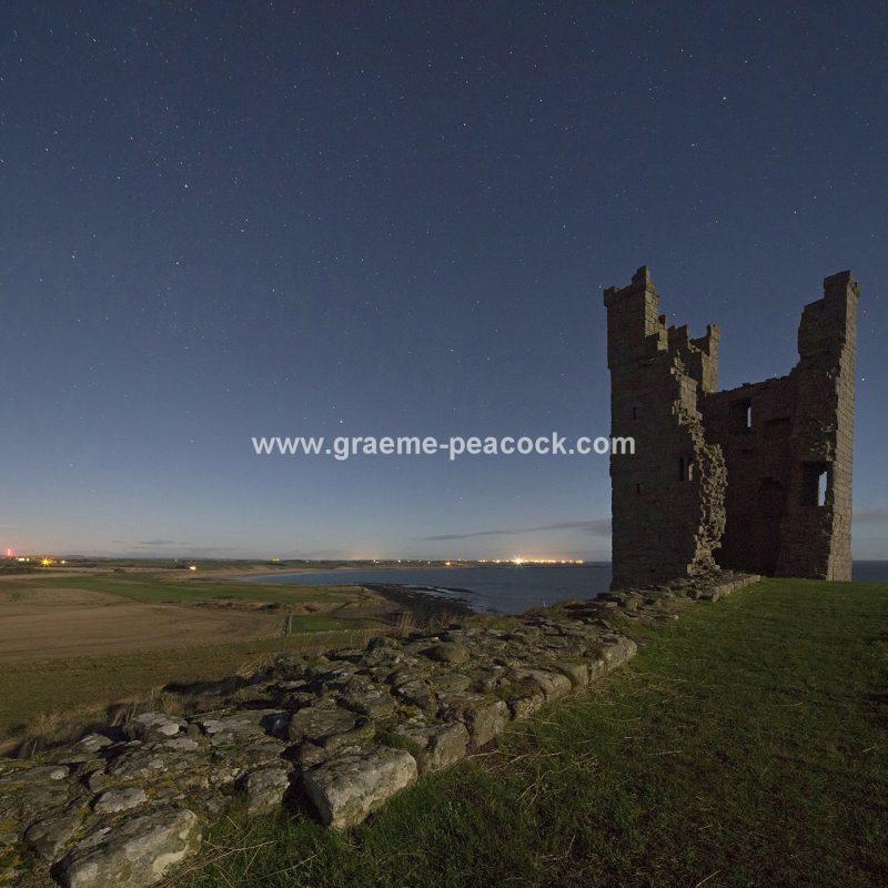 Star gazing under 'Dark Skies' at Dunstanburgh Castle near Craster, Northumberland
