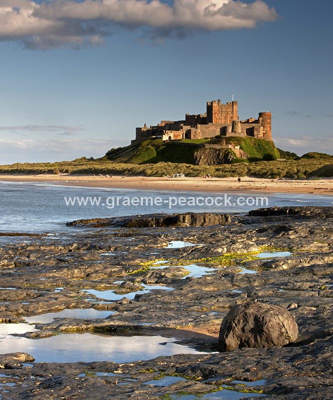 Bamburgh Castle and village in evening light, Bamburgh, Northumberland