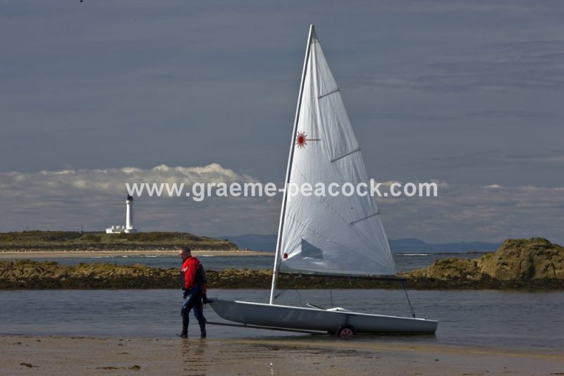 Yacht at Covesea lighthouse,  Lossiemouth,  Moray,  Scotland