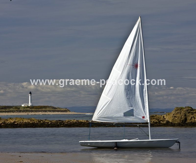Yacht at Covesea lighthouse,  Lossiemouth,  Moray,  Scotland