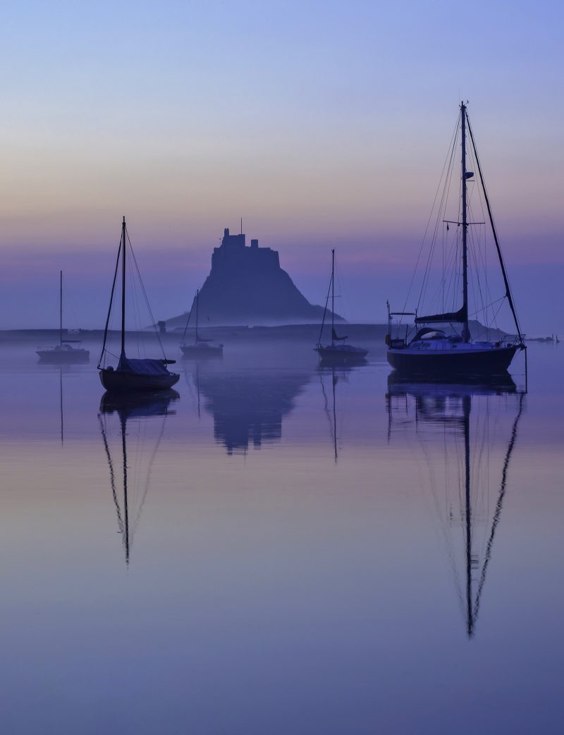 Sunrise over Lindisfarne Castle on the Holy Island of Lindisfarne, Northumberland, England, United Kingdom