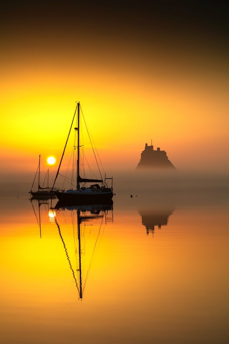 Sunrise over Lindisfarne Castle on the Holy Island of Lindisfarne, Northumberland, England, United Kingdom