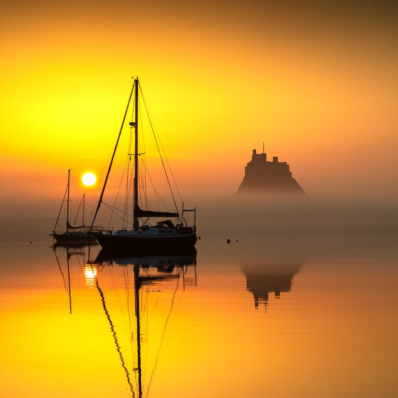 Sunrise over Lindisfarne Castle on the Holy Island of Lindisfarne, Northumberland, England, United Kingdom