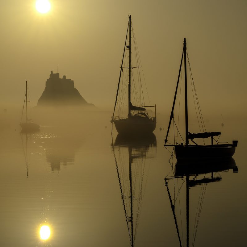Sunrise over Lindisfarne Castle on the Holy Island of Lindisfarne, Northumberland, England, United Kingdom