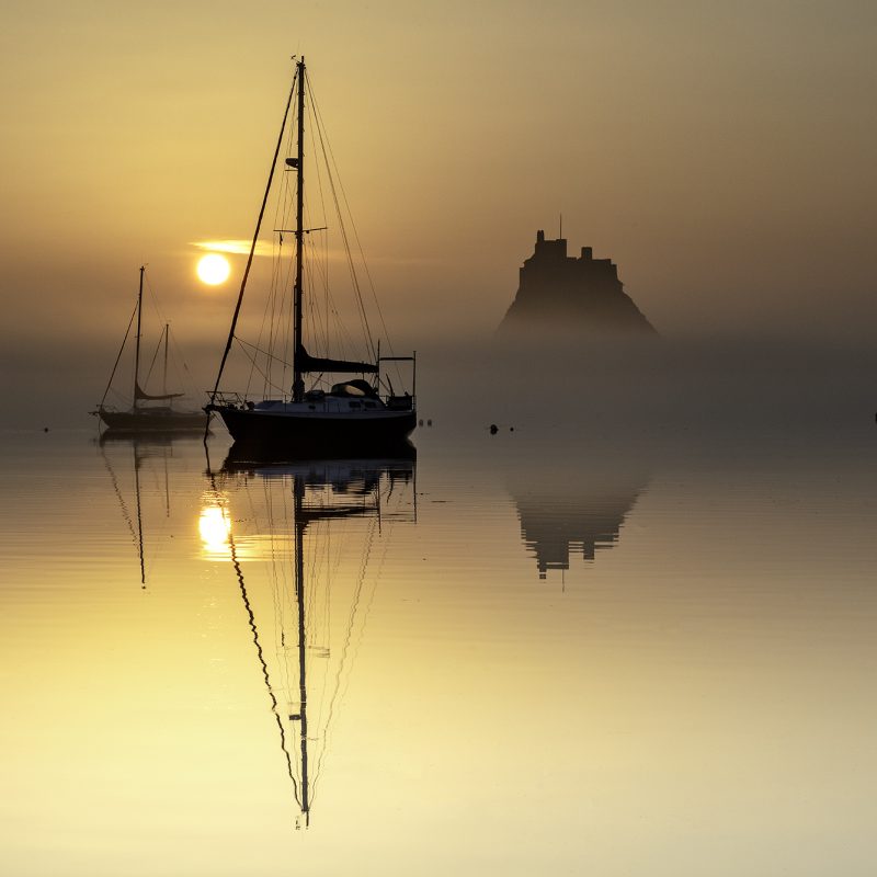 Sunrise over Lindisfarne Castle on the Holy Island of Lindisfarne, Northumberland, England, United Kingdom