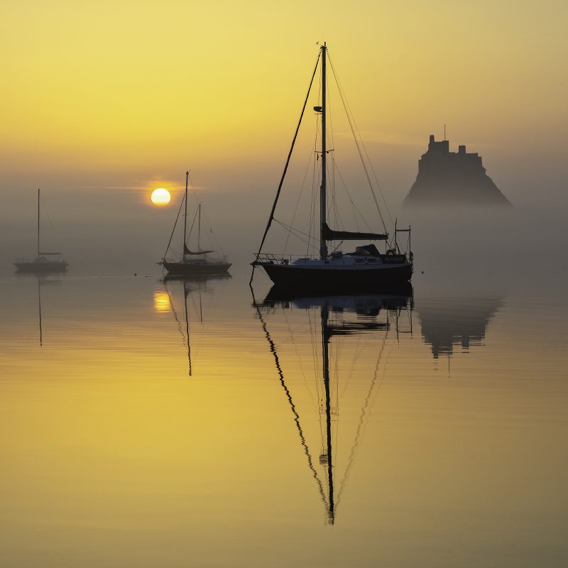 Sunrise over Lindisfarne Castle on the Holy Island of Lindisfarne, Northumberland, England, United Kingdom