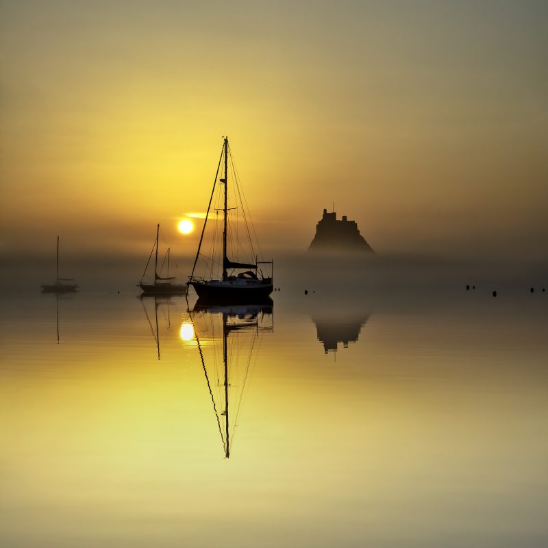 Sunrise over Lindisfarne Castle on the Holy Island of Lindisfarne, Northumberland, England, United Kingdom