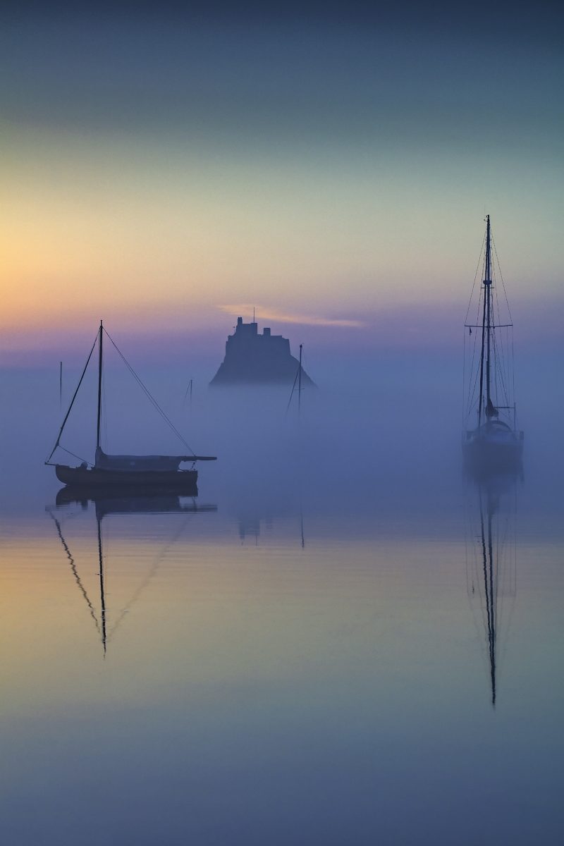 Sunrise over Lindisfarne Castle on the Holy Island of Lindisfarne, Northumberland, England, United Kingdom