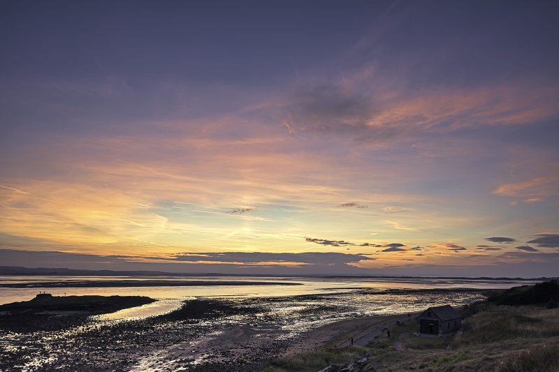 Sunset over St Cuthbert's Island, Lindisfarne, Northumberland, England, United Kingdom