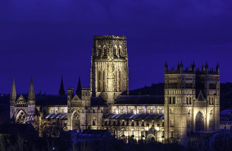 Durham Cathedral floodlit at dusk, Durham City, County Durham, England, UK